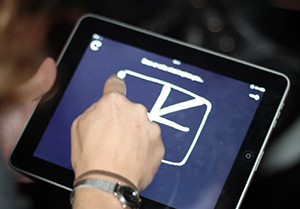 Someone drawing on an iPad using DrawPad